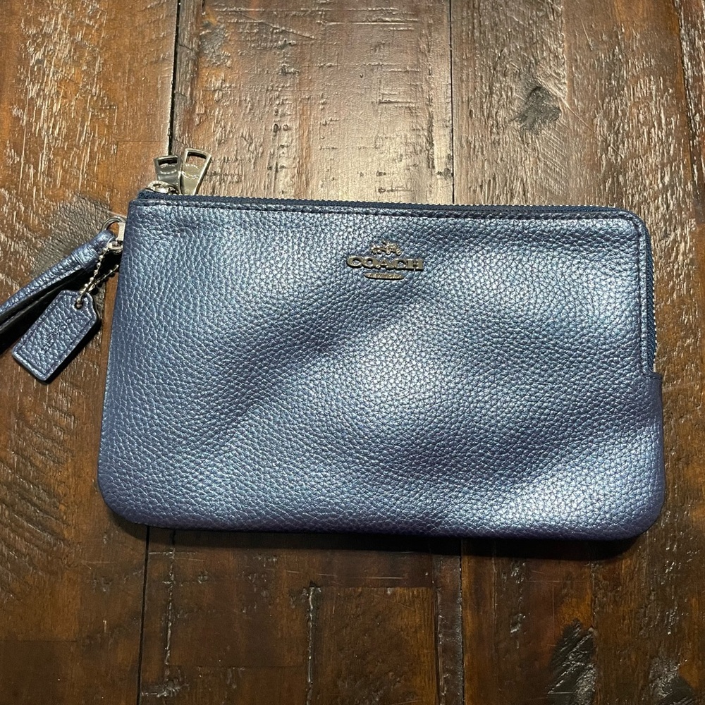 Coach double zippered wristlet in metallic blue.